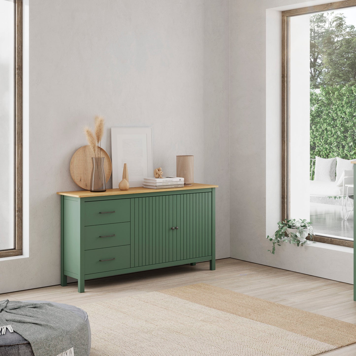 A pair of sage green wooden sideboards in a bright, modern room. One is a three-drawer cabinet with a light wood top, and the other is a two-door cabinet with a matching light wood top.