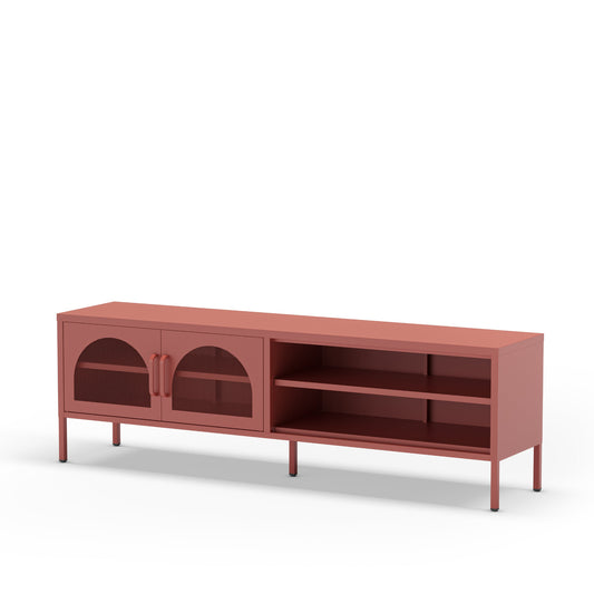 A modern media console in a muted terracotta red color, featuring two cabinet doors with arched glass fronts on the left and open shelving on the right, supported by slim legs.