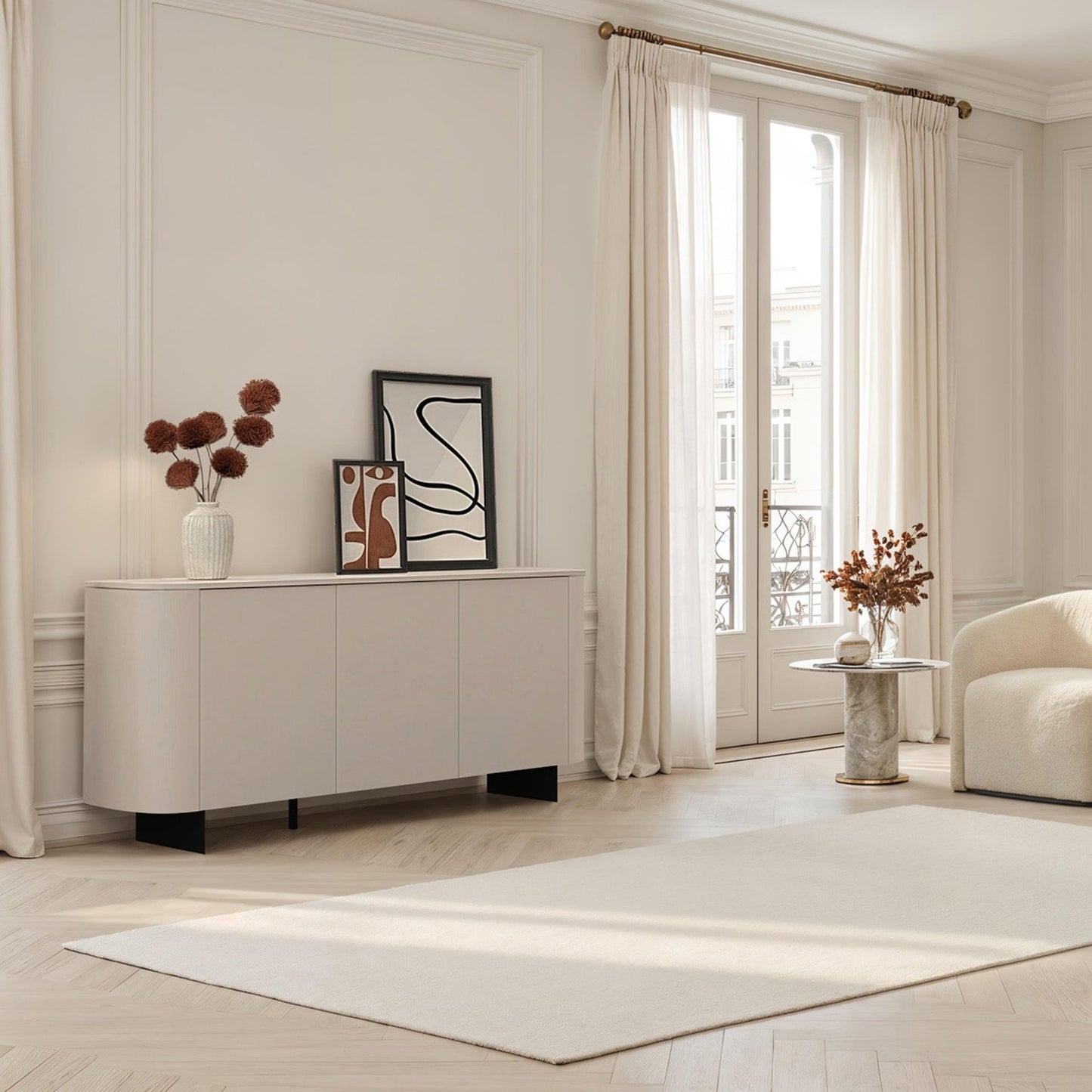 Modern living room with neutral tones, furniture, and decor.
