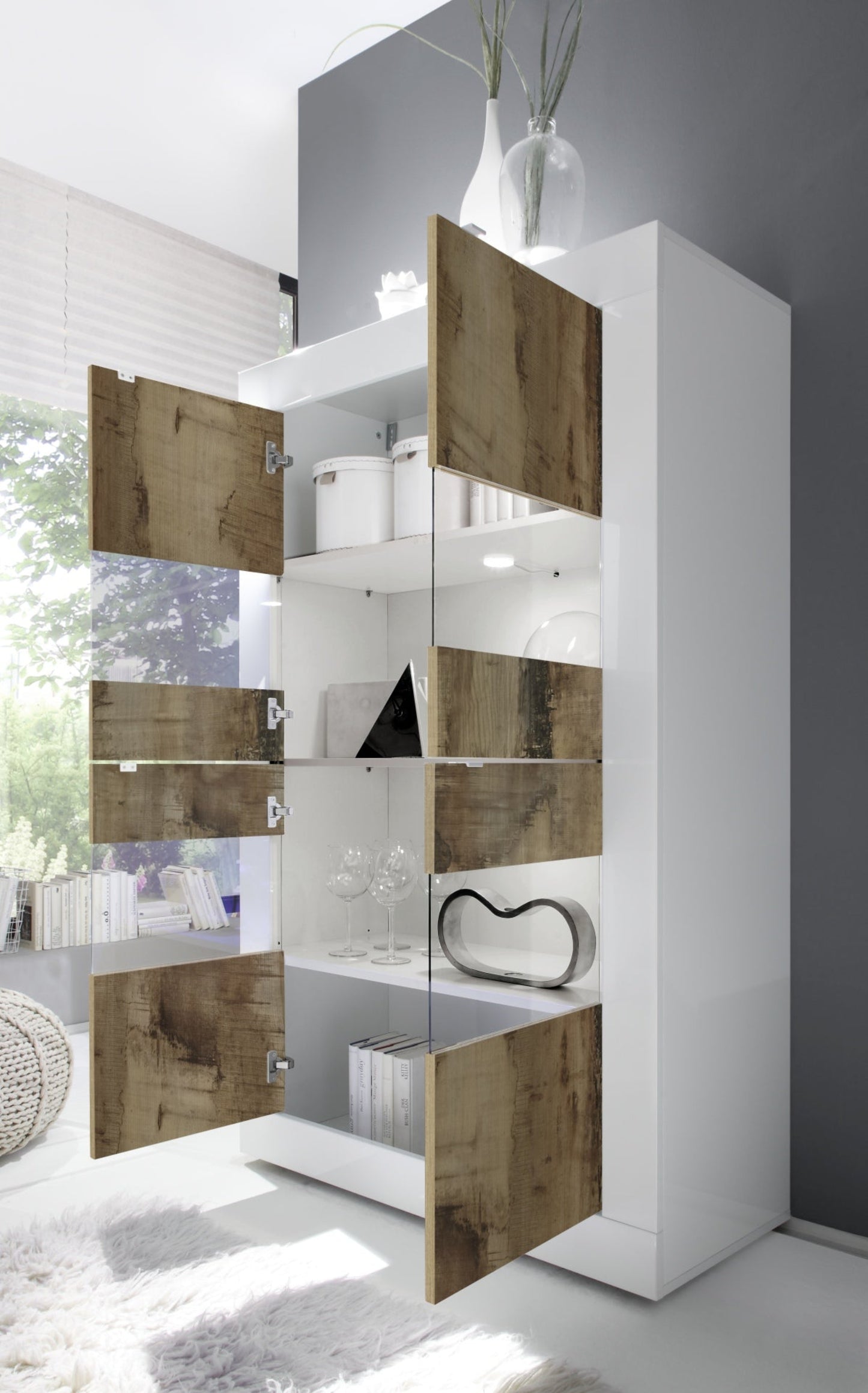 Modern white cabinet with wooden doors in a room setting