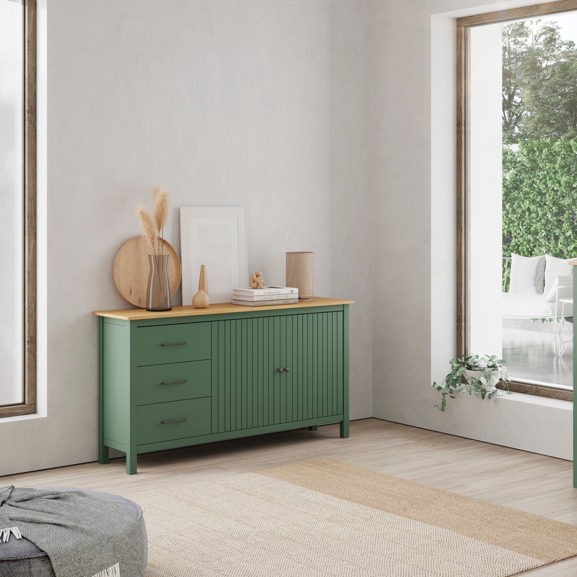 A pair of sage green wooden sideboards in a bright, modern room. One is a three-drawer cabinet with a light wood top, and the other is a two-door cabinet with a matching light wood top.