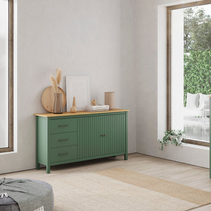 A pair of sage green wooden sideboards in a bright, modern room. One is a three-drawer cabinet with a light wood top, and the other is a two-door cabinet with a matching light wood top.