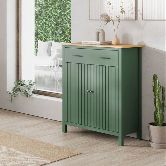 A pair of sage green wooden sideboards in a bright, modern room. One is a three-drawer cabinet with a light wood top, and the other is a two-door cabinet with a matching light wood top.