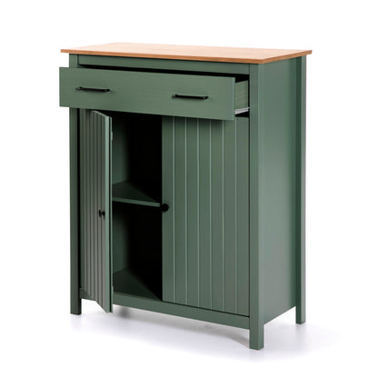 A green kitchen cabinet with a light wood countertop, featuring a top drawer with black handles and a lower cabinet with one door open to show shelving inside.