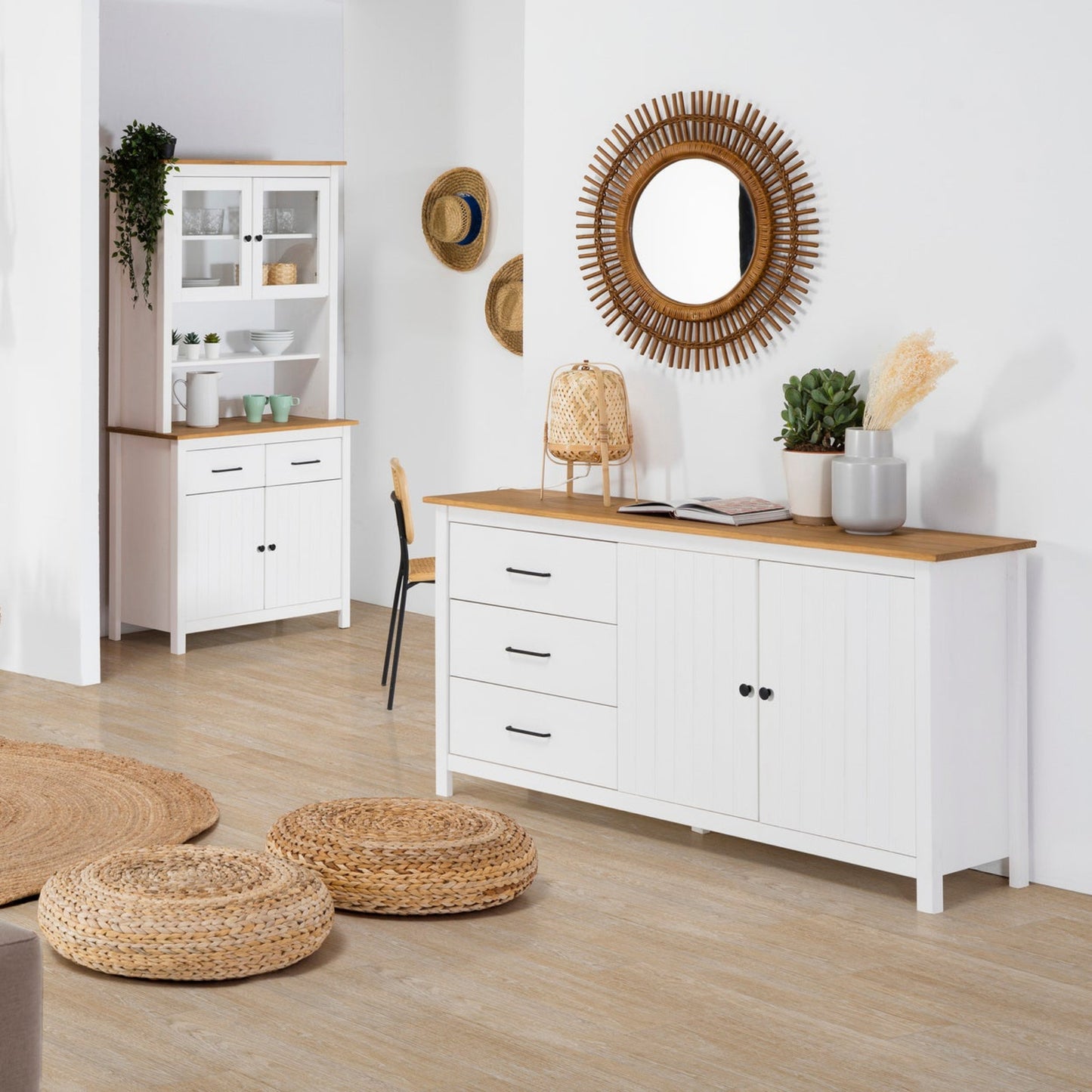Modern living room with white furniture, wooden accents, and decorative items.