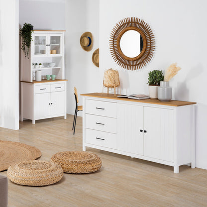 Modern living room with white furniture, wooden accents, and decorative items.