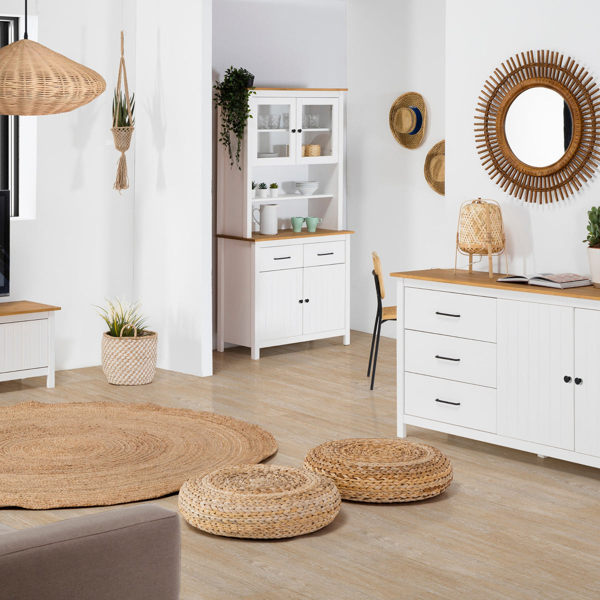 Modern living room with white furniture, wooden accents, and decorative items.