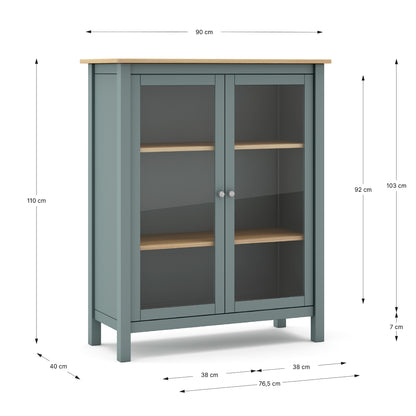 A tall cabinet with two glass doors and light wood shelves on a white background, overlaid with dimension lines and measurements including 90 cm width, 110 cm height, 76,5 cm depth, and 40 cm leg width.