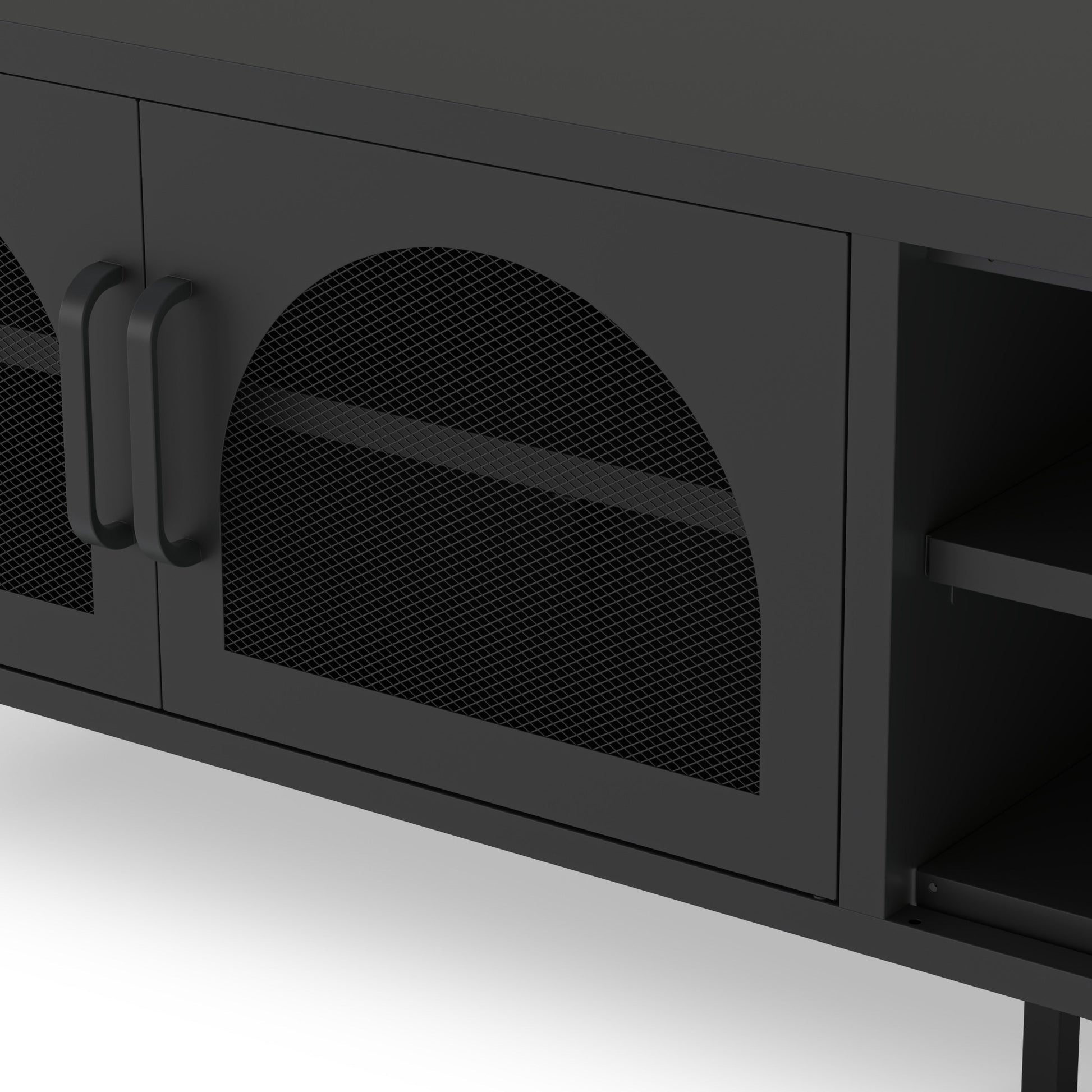 Close-up of a modern black cabinet with mesh-patterned doors and dark metal handles, showing part of an open shelf on the right.