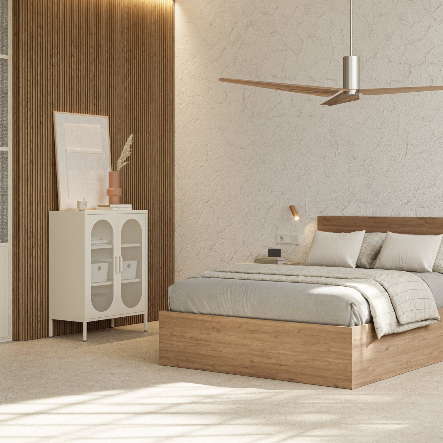 A modern bedroom featuring a low wooden platform bed with light gray bedding, a matching wooden headboard, a white cabinet with glass doors, and a textured beige wall with warm ambient lighting.