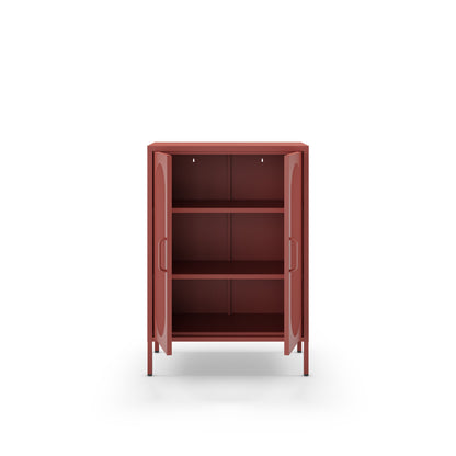 A small two-door cabinet in a muted terracotta red color, shown open with three interior shelves. The cabinet has a minimalist design with slim handles and is photographed against a solid white background.