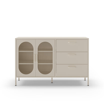 A modern sideboard cabinet with two glass-front doors on the left and three drawers on the right, finished in a light warm gray or greige tone with slim metal handles and legs.