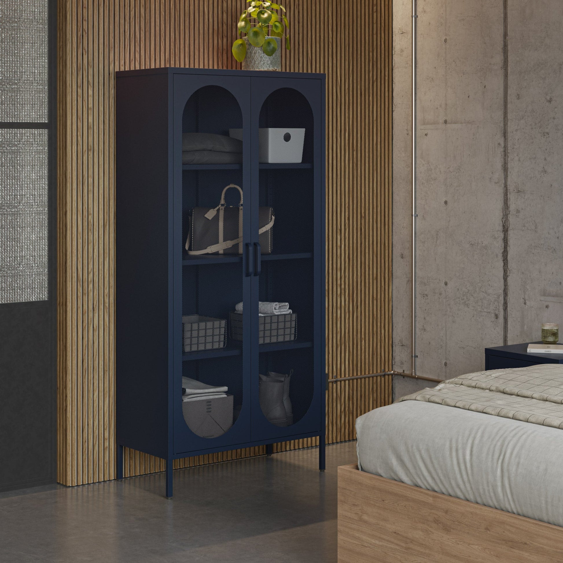 Blue cabinet in a room with a bed and decorative elements.