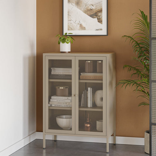 Beige cabinet with glass doors against a wall with a framed picture and plant.