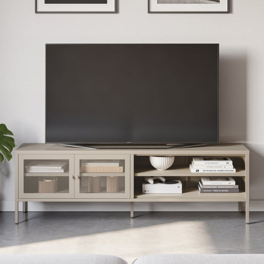 A light beige wood TV stand console with glass-front cabinets and open shelving, holding a large black television and decorative items, set in a modern living room.