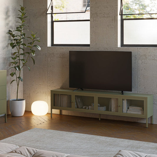 Modern living room with a TV on a stand, cabinet, and decorative items.
