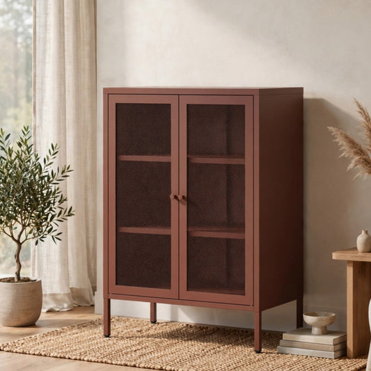 A tall wooden cabinet with two dark glass-paneled doors stands in a styled room with a woven rug, potted plant, side table, and neutral decor.
