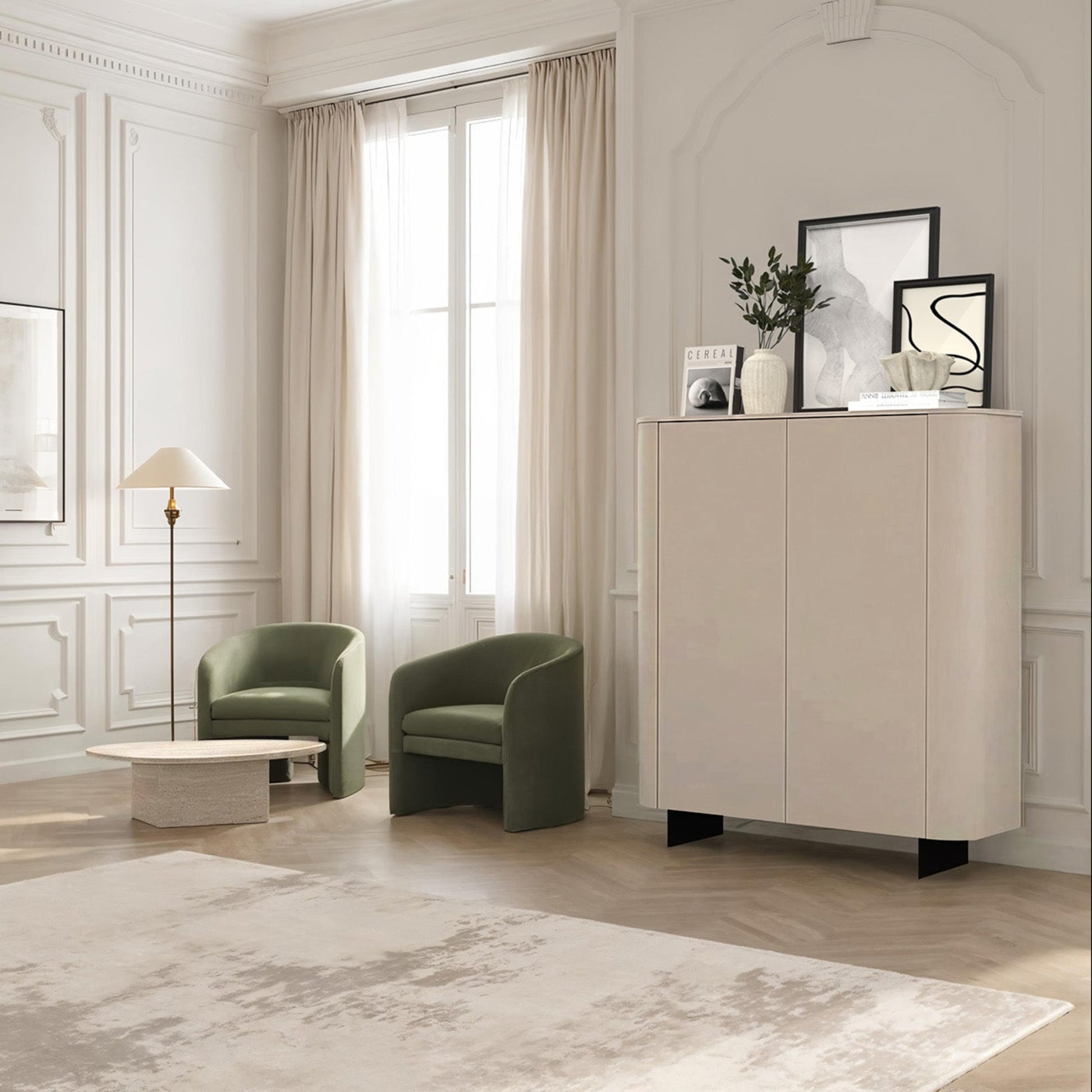 Modern living room with a TV, armchairs, and a cabinet.