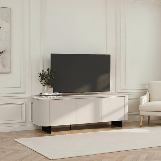 Modern living room with a television on a wooden stand, a chair, and decorative elements.