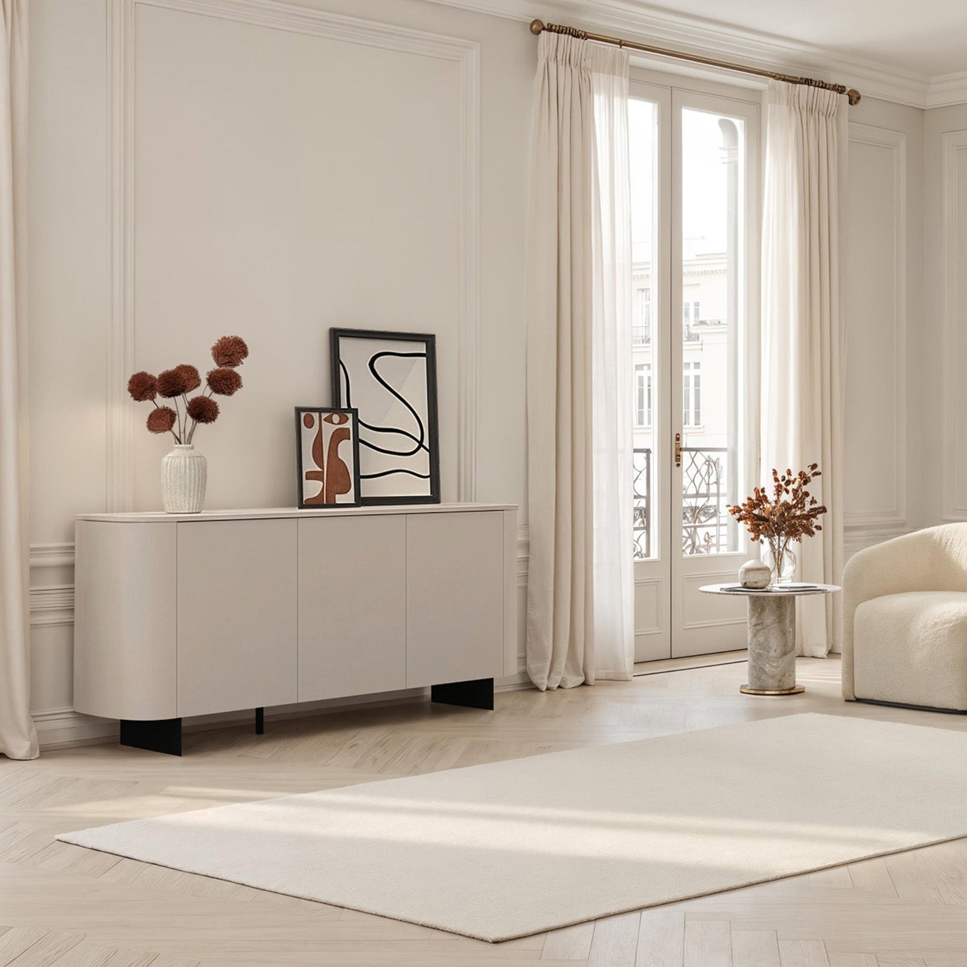 Modern living room with neutral tones, furniture, and decor.