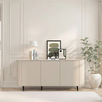 Modern living room with a sideboard, plant, and chair.