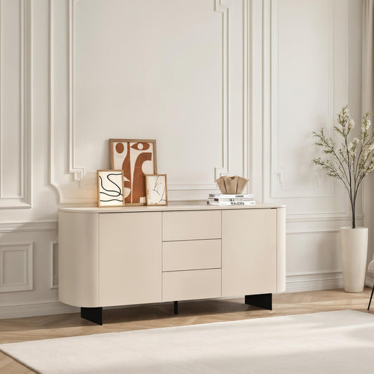 Beige sideboard in a modern living room with decor items and a chair.