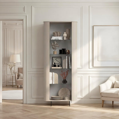 Modern interior design with a bookshelf, armchair, and decorative items in a well-lit room.