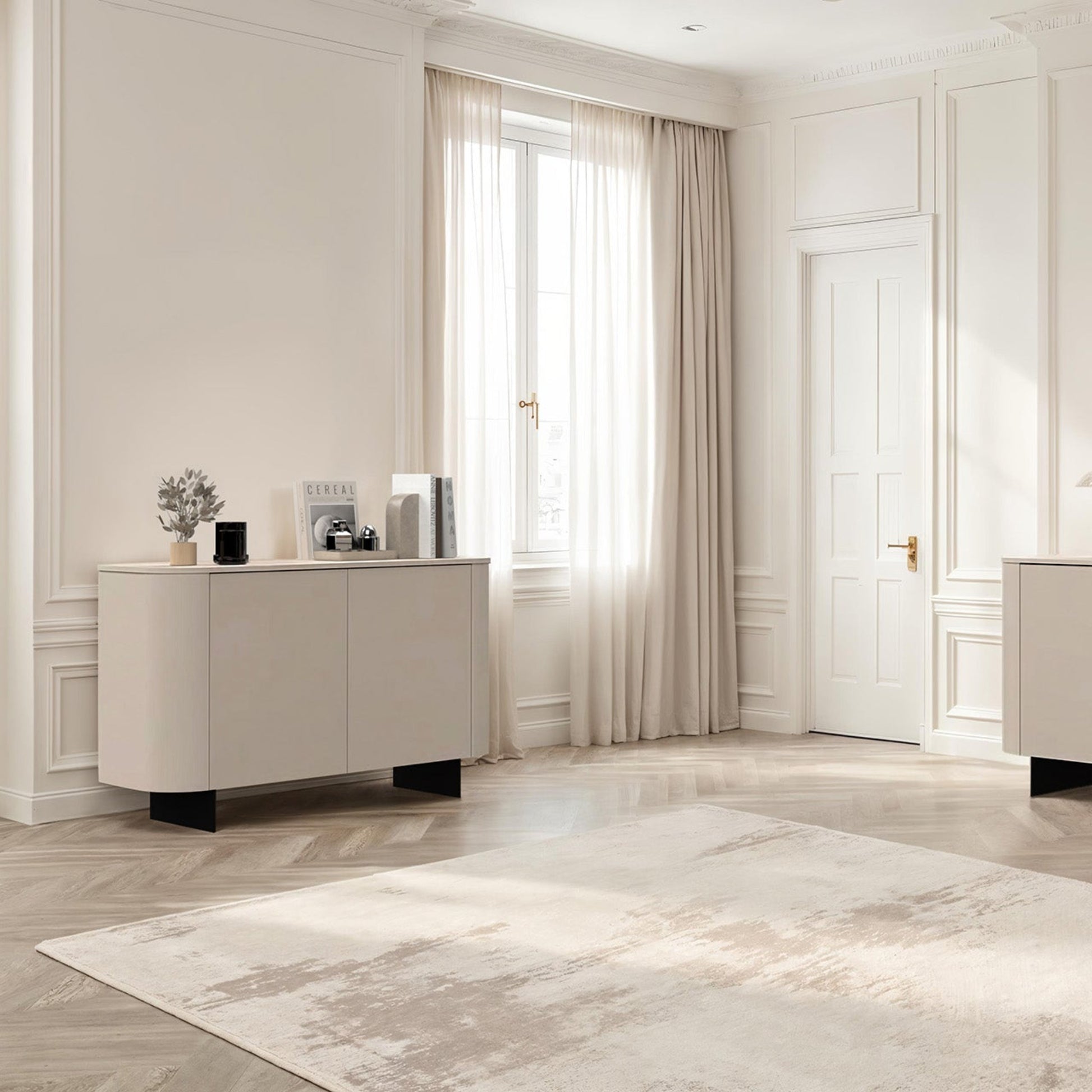 Modern interior with light-colored furniture and decor elements.