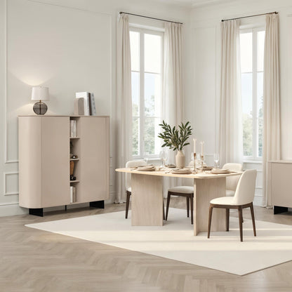Modern dining room with light wood furniture and large windows.