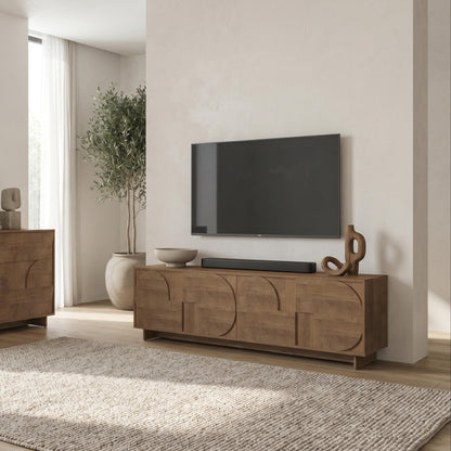 Modern living room with wooden sideboard, TV, and decor items.