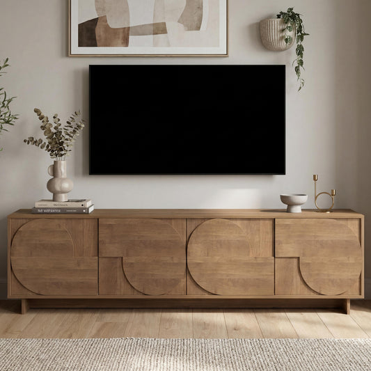 Wooden sideboard with a television above it in a living room setting.