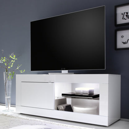 Modern white TV stand with a flat-screen TV against a dark wall.