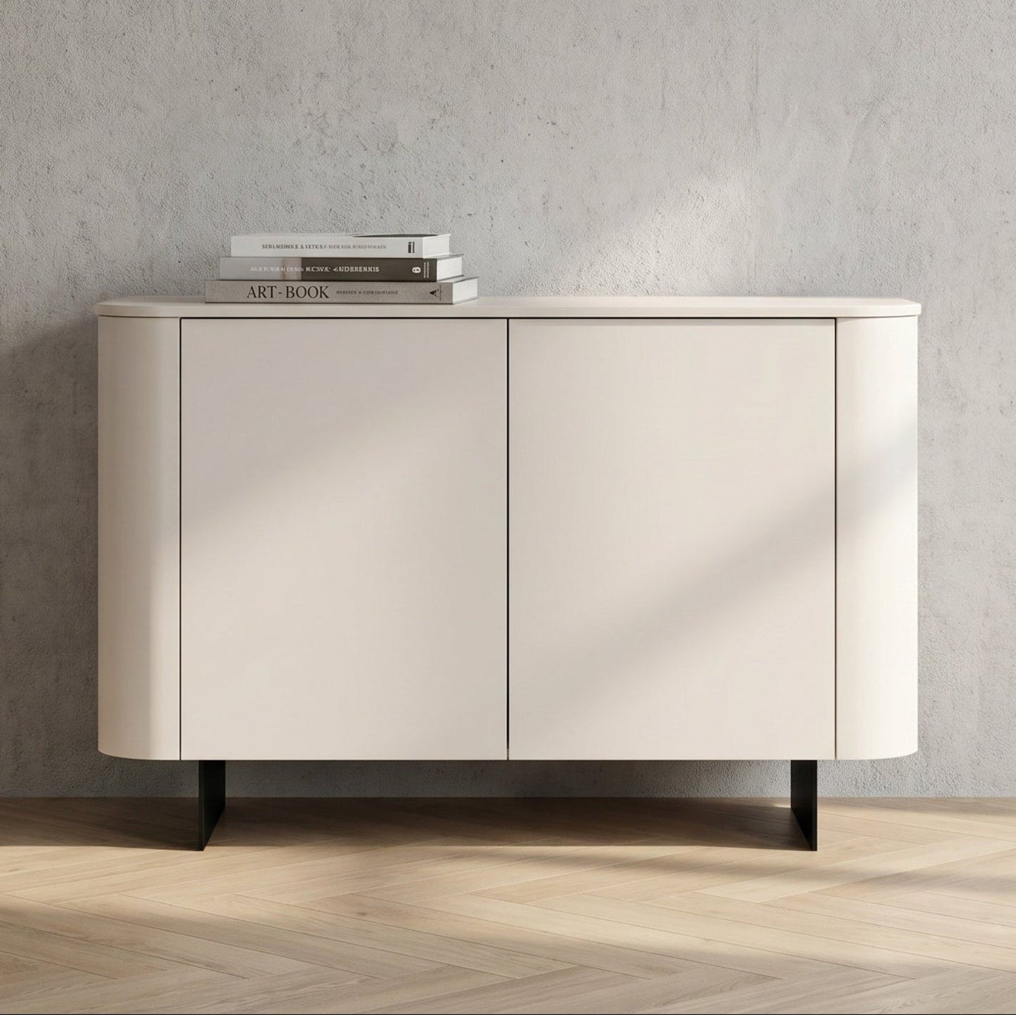 A modern sideboard cabinet with two doors, featuring a curved outer frame, a light beige finish, and black legs, set against a textured gray wall and light wood herringbone floor.