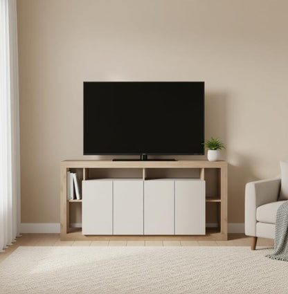 A light wood TV stand with white cabinet doors and open shelving, holding a black flat-screen TV in a minimalist living room with beige walls and a white armchair.